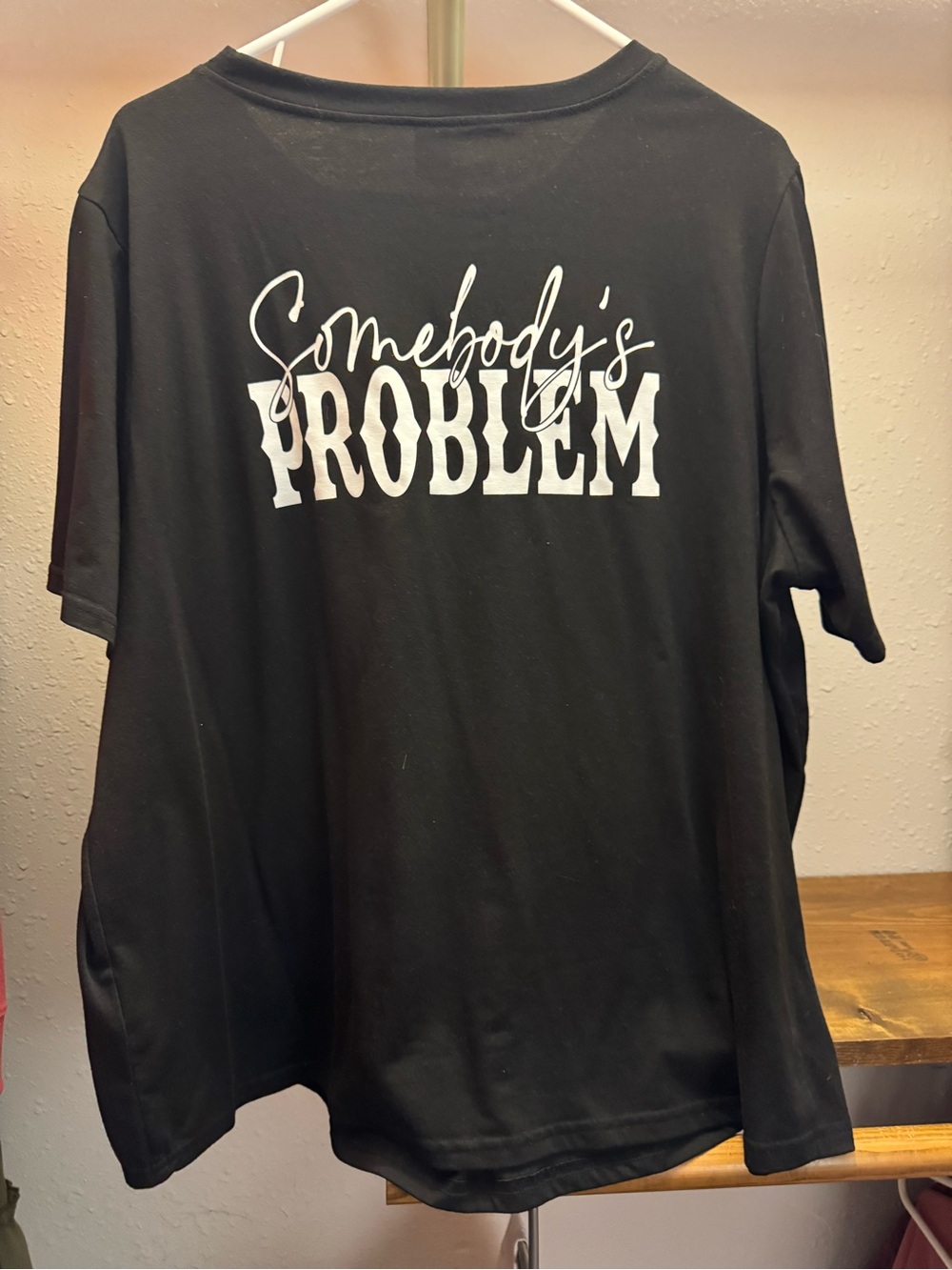 Black women’s Graphic Tee with "Somebody's Problem" Print